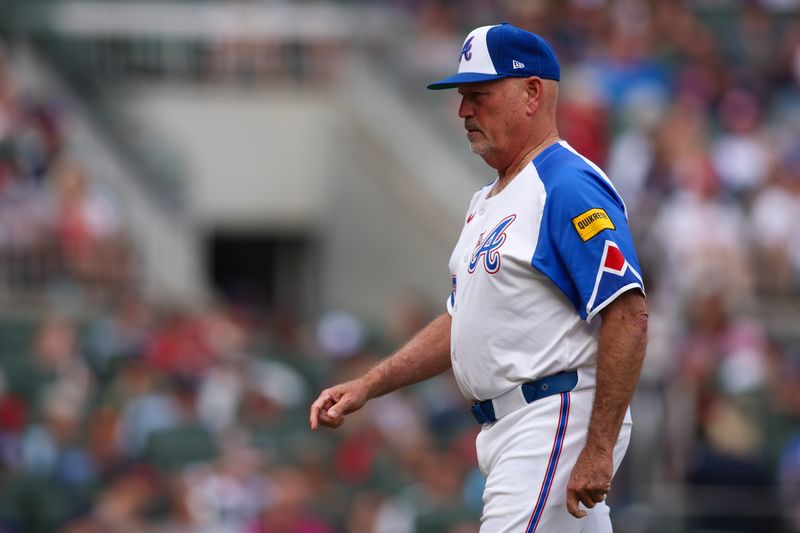 May 31, 2025; Atlanta, Georgia, USA; Atlanta Braves manager Brian Snitker (43) makes a pitching change against the Boston Red Sox in the seventh inning at Truist Park. Mandatory Credit: Brett Davis-Imagn Images