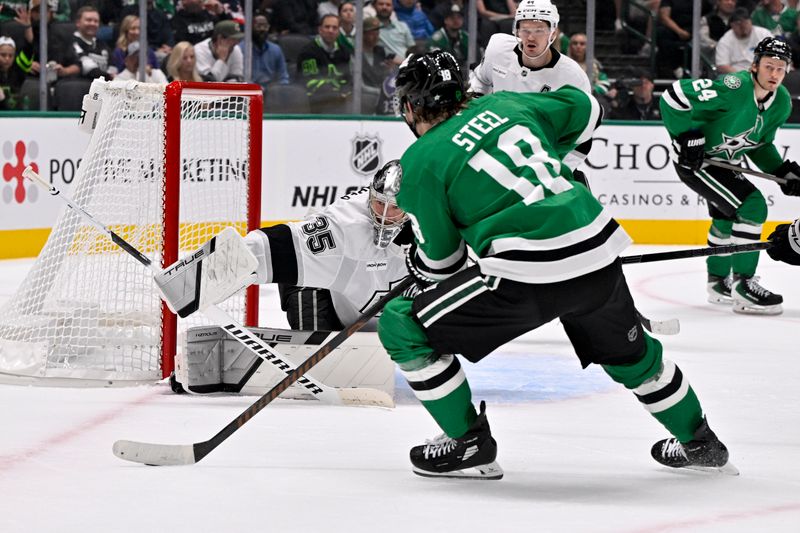 Oct 23, 2025; Dallas, Texas, USA; Los Angeles Kings goaltender Darcy Kuemper (35) stops a shot by Dallas Stars center Sam Steel (18) during the second period at the American Airlines Center. Mandatory Credit: Jerome Miron-Imagn Images