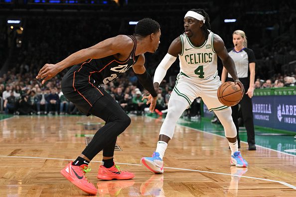 BOSTON, MASSACHUSETTS - DECEMBER 28: Jrue Holiday #4 of the Boston Celtics drives to the basket against Jaden Ivey #23 of the Detroit Pistons during the first quarter at TD Garden on December 28, 2023 in Boston, Massachusetts. NOTE TO USER: User expressly acknowledges and agrees that, by downloading and or using this photograph, User is consenting to the terms and conditions of the Getty Images License Agreement. (Photo by Brian Fluharty/Getty Images)