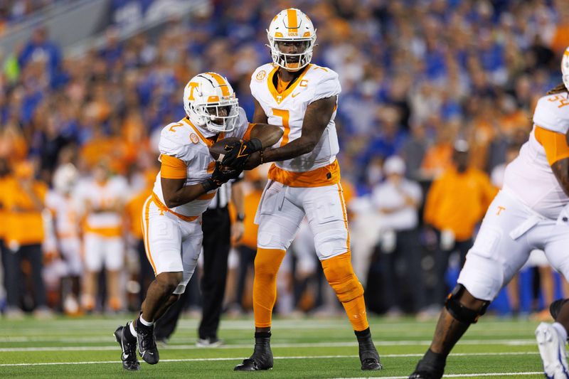 Oct 28, 2023; Lexington, Kentucky, USA; Tennessee Volunteers quarterback Joe Milton III (7) hands the ball off to Tennessee Volunteers running back Jabari Small (2) during the first quarter against the Kentucky Wildcats at Kroger Field. Mandatory Credit: Jordan Prather-USA TODAY Sports