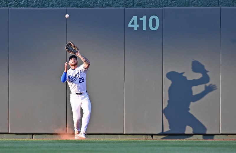 Aug 5, 2024; Kansas City, Missouri, USA;  Kansas City Royals center fielder Kyle Isbel (28) catches a fly ball in the second inning against the Boston Red Sox at Kauffman Stadium. Mandatory Credit: Peter Aiken-USA TODAY Sports