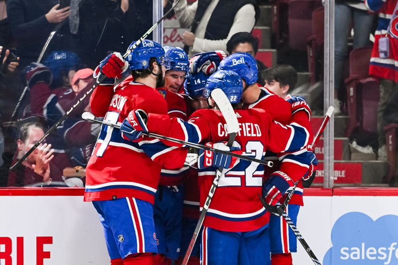 Oct 28, 2023; Montreal, Quebec, CAN; Montreal Canadiens center Sean Monahan (91) celebrates his goal against the Winnipeg Jets with his teammates during the second period at Bell Centre. Mandatory Credit: David Kirouac-USA TODAY Sports