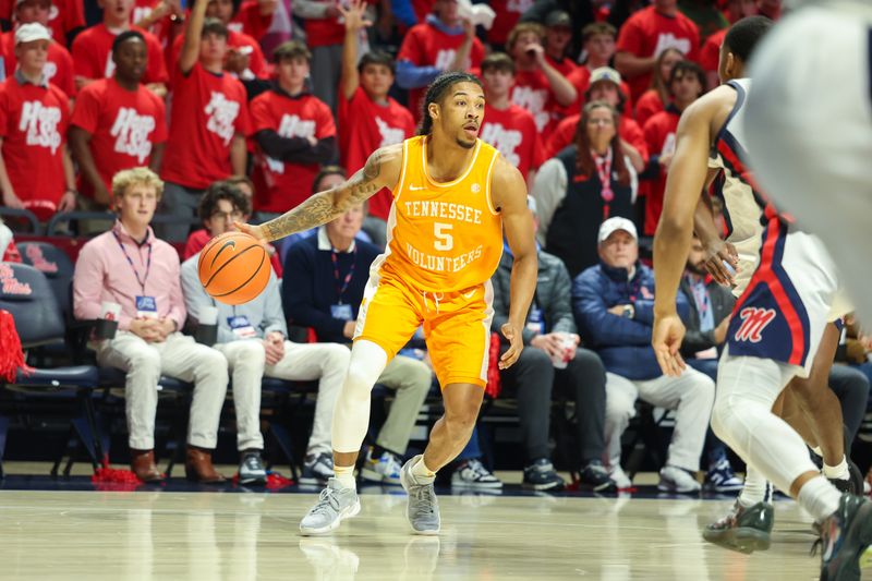Mar 5, 2025; Oxford, Mississippi, USA; Tennessee Volunteers guard Zakai Zeigler (5) looks to pass the ball against the Mississippi Rebels during the first half at The Sandy and John Black Pavilion at Ole Miss. Mandatory Credit: Wesley Hale-Imagn Images