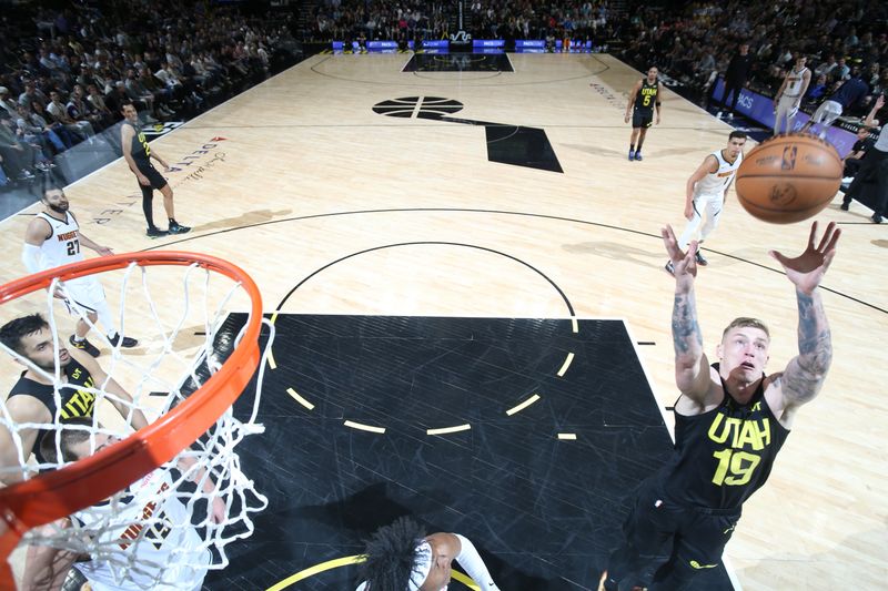 SALT LAKE CITY, UT - APRIL 9: Luka Samanic #19 of the Utah Jazz grabs the rebound during the game against the Denver Nuggets on April 9, 2024 at Delta Center in Salt Lake City, Utah. NOTE TO USER: User expressly acknowledges and agrees that, by downloading and or using this Photograph, User is consenting to the terms and conditions of the Getty Images License Agreement. Mandatory Copyright Notice: Copyright 2024 NBAE (Photo by Melissa Majchrzak/NBAE via Getty Images)