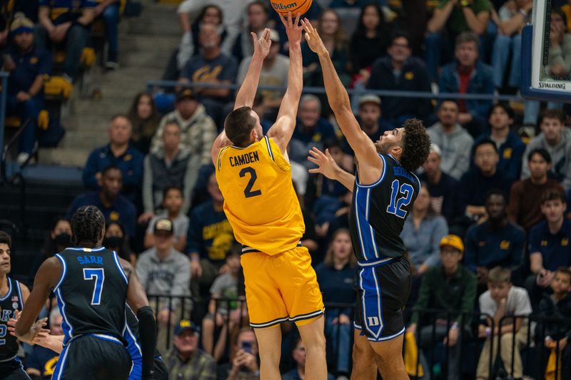 Jan 14, 2026; Berkeley, California, USA; California Golden Bears forward John Camden (2) shoots a three point shot against Duke Blue Devils forward Cameron Boozer (12) during the first half at Haas Pavilion. Mandatory Credit: Neville E. Guard-Imagn Images