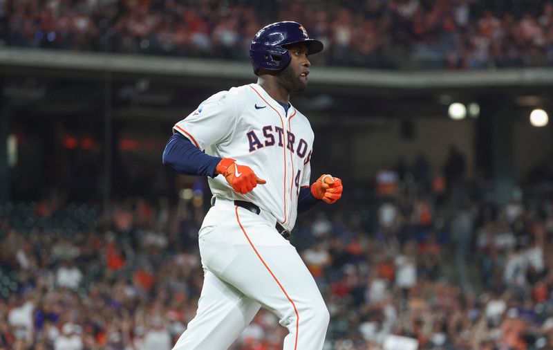 Apr 3, 2024; Houston, Texas, USA; Houston Astros left fielder Yordan Alvarez (44) runs to first on an RBI double during the fourth inning against the Toronto Blue Jays at Minute Maid Park. Mandatory Credit: Troy Taormina-USA TODAY Sports