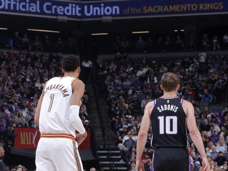 SACRAMENTO, CA - FEBRUARY 22: Victor Wembanyama #1 of the San Antonio Spurs and Domantas Sabonis #10 of the Sacramento Kings look on during the game on February 22, 2024 at Golden 1 Center in Sacramento, California. NOTE TO USER: User expressly acknowledges and agrees that, by downloading and or using this Photograph, user is consenting to the terms and conditions of the Getty Images License Agreement. Mandatory Copyright Notice: Copyright 2023 NBAE (Photo by Rocky Widner/NBAE via Getty Images)