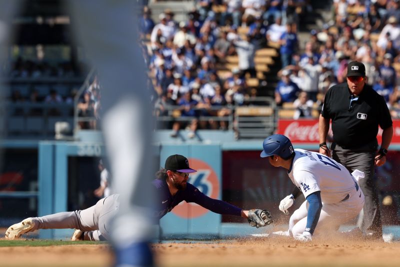 Sep 22, 2024; Los Angeles, California, USA;  Los Angeles Dodgers designated hitter Shohei Ohtani (17) steals second base during the seventh inning against the Colorado Rockies at Dodger Stadium. Mandatory Credit: Kiyoshi Mio-Imagn Images