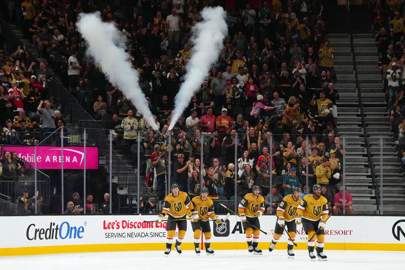 Sep 27, 2024; Las Vegas, Nevada, USA; Vegas Golden Knights right wing Keegan Kolesar (55) leads his team mates back to the bench after scoring a goal against the Utah Hockey Club during the third period at T-Mobile Arena. Mandatory Credit: Stephen R. Sylvanie-Imagn Images