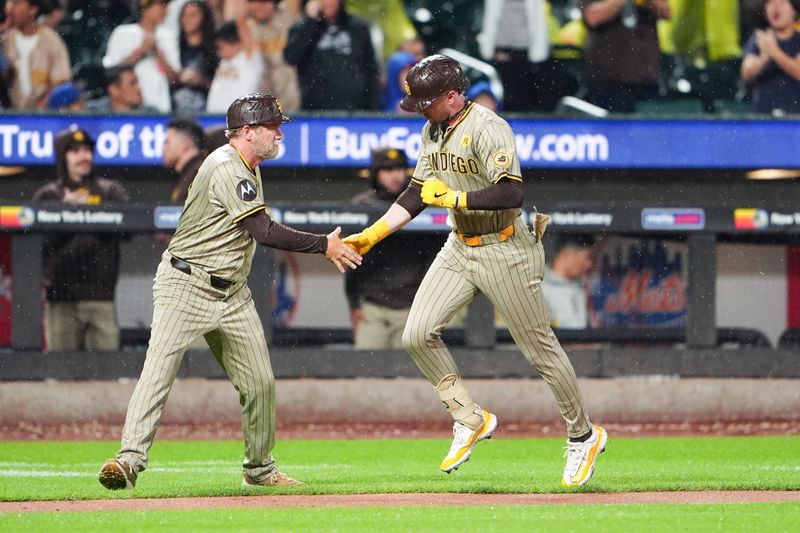 Jun 14, 2024; New York City, New York, USA; San Diego Padres second baseman Jake Cronenworth (9) is congratulated by third base coach Tim Leiper (33) for hitting a home run as he rounds the bases against the New York Mets during the fifth inning at Citi Field. Mandatory Credit: Gregory Fisher-USA TODAY Sports