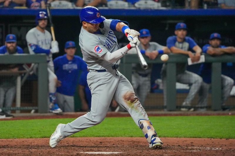 Jul 26, 2024; Kansas City, Missouri, USA; Chicago Cubs right fielder Seiya Suzuki (27) hits a double against the Kansas City Royals in the ninth inning at Kauffman Stadium. Mandatory Credit: Denny Medley-USA TODAY Sports