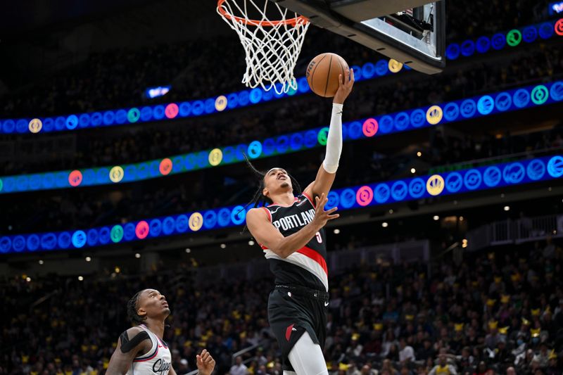 SEATTLE, WASHINGTON - OCTOBER 11: Dalano Banton #5 of the Portland Trail Blazers drives to the basket during the third quarter of the Rain City Showcase game against the LA Clippers at Climate Pledge Arena on October 11, 2024 in Seattle, Washington. The LA Clippers won 101-99. NOTE TO USER: User expressly acknowledges and agrees that, by downloading and or using this photograph, User is consenting to the terms and conditions of the Getty Images License Agreement. (Photo by Alika Jenner/Getty Images)