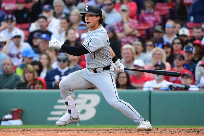 Sep 8, 2024; Boston, Massachusetts, USA;  Chicago White Sox pinch hitter Dominic Fletcher (7) hits an RBI double during the ninth inning against the Boston Red Sox at Fenway Park. Mandatory Credit: Bob DeChiara-Imagn Images