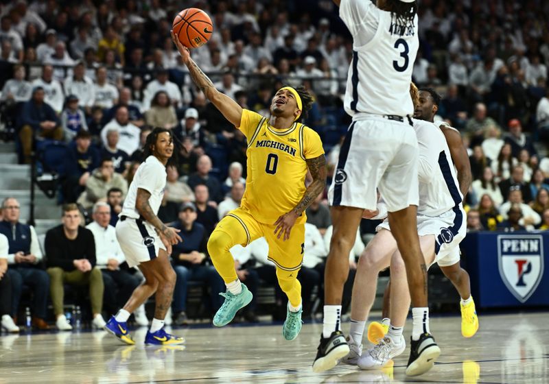 Jan 7, 2024; Philadelphia, Pennsylvania, USA; Michigan Wolverines guard Dug McDaniel (0) drives against the Penn State Nittany Lions in the second half at The Palestra. Mandatory Credit: Kyle Ross-USA TODAY Sports