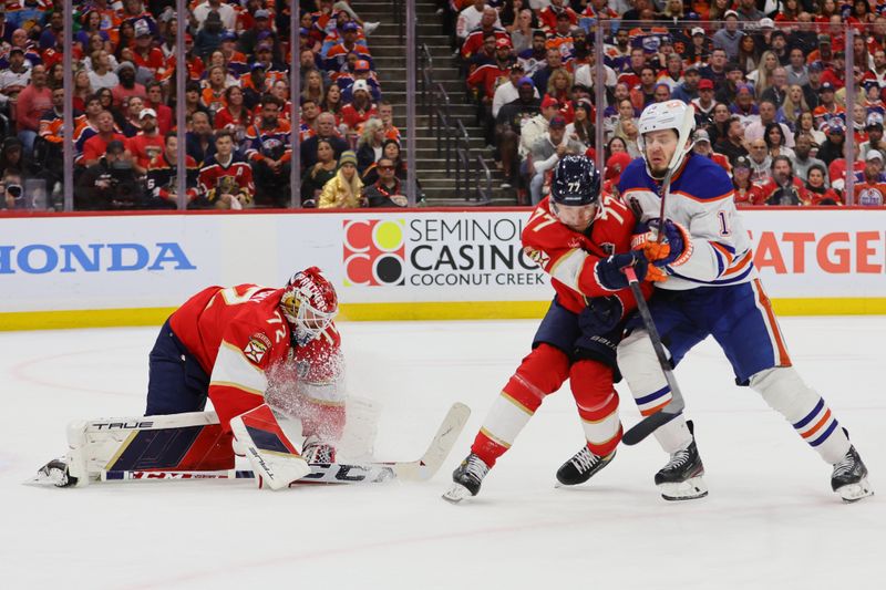 Jun 24, 2024; Sunrise, Florida, USA; Florida Panthers defenseman Niko Mikkola (77) and goaltender Sergei Bobrovsky (72) defend against Edmonton Oilers forward Mattias Janmark (13) during the third period in game seven of the 2024 Stanley Cup Final at Amerant Bank Arena. Mandatory Credit: Sam Navarro-USA TODAY Sports