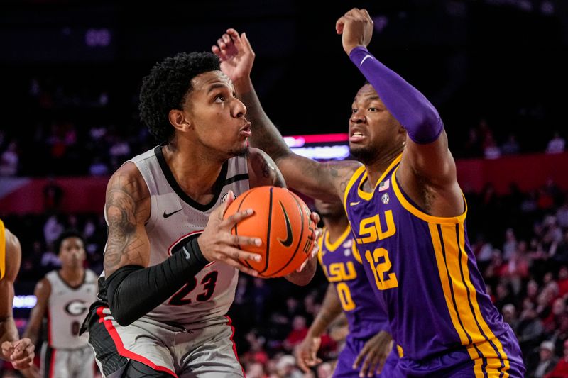 Feb 14, 2023; Athens, Georgia, USA; Georgia Bulldogs center Braelen Bridges (23) is defended by LSU Tigers forward KJ Williams (12) during the second half at Stegeman Coliseum. Mandatory Credit: Dale Zanine-USA TODAY Sports