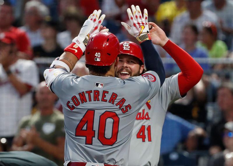 Jul 3, 2024; Pittsburgh, Pennsylvania, USA;  St. Louis Cardinals right fielder Alec Burleson (41) greets catcher Willson Contreras (40) crossing home plate on a two run home run against the Pittsburgh Pirates during the eighth inning at PNC Park. Mandatory Credit: Charles LeClaire-USA TODAY Sports