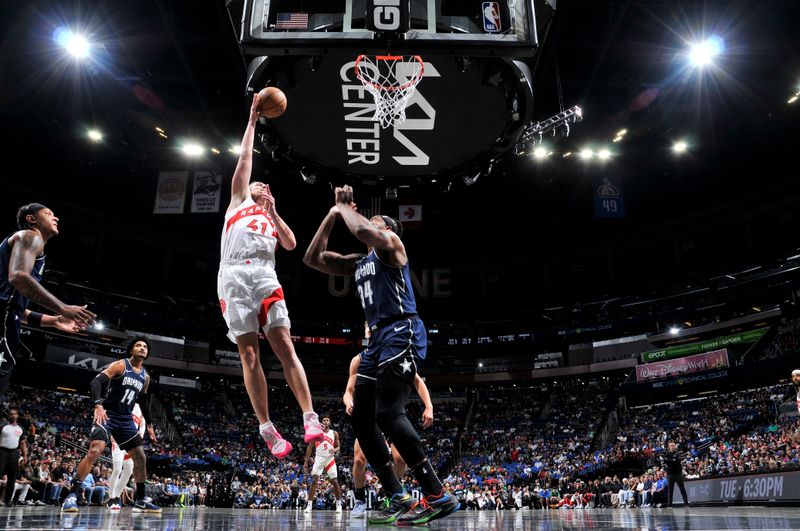 ORLANDO, FL - MARCH 17: Kelly Olynyk #41 of the Toronto Raptor drives to the basket during the game against the Orlando Magic on March 17, 2024 at the Kia Center in Orlando, Florida. NOTE TO USER: User expressly acknowledges and agrees that, by downloading and or using this photograph, User is consenting to the terms and conditions of the Getty Images License Agreement. Mandatory Copyright Notice: Copyright 2024 NBAE (Photo by Fernando Medina/NBAE via Getty Images)