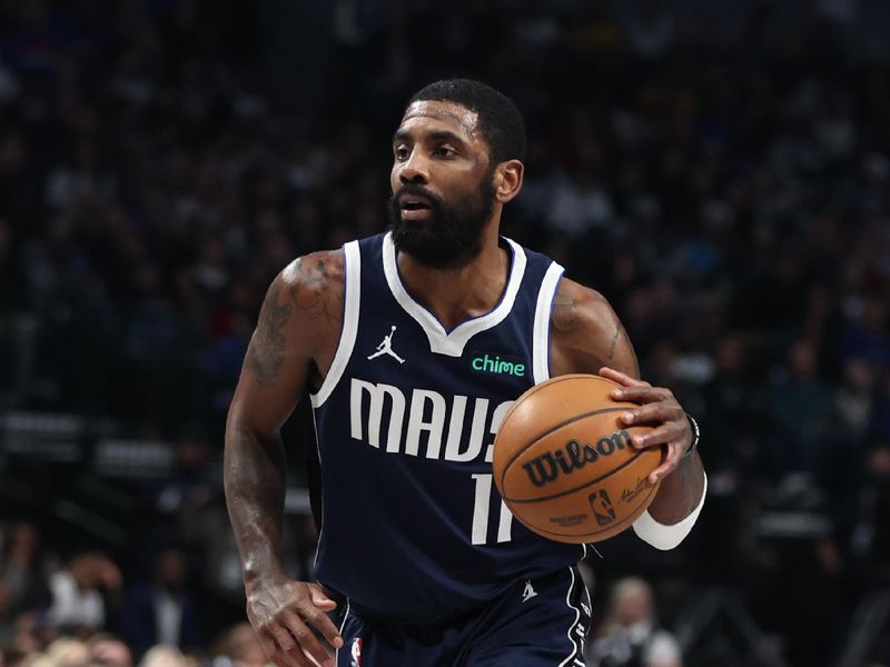 DALLAS, TX - FEBRUARY 12:  Kyrie Irving #11 of the Dallas Mavericks drives to the basket during the game against the Golden State Warriors on February 12, 2025 at American Airlines Center in Dallas, Texas. NOTE TO USER: User expressly acknowledges and agrees that, by downloading and or using this photograph, User is consenting to the terms and conditions of the Getty Images License Agreement. Mandatory Copyright Notice: Copyright 2025 NBAE (Photo by Tim Heitman/NBAE via Getty Images)