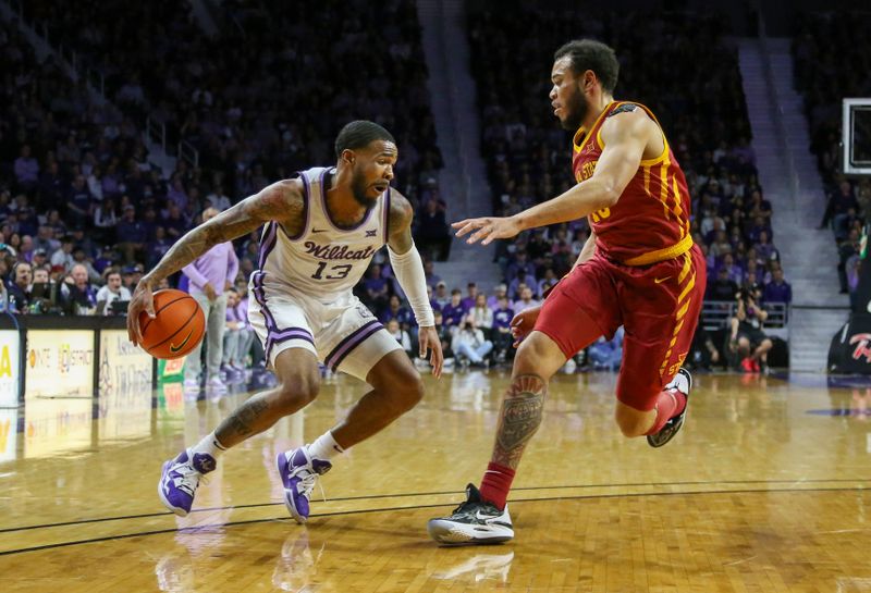 Feb 18, 2023; Manhattan, Kansas, USA; Kansas State Wildcats guard Desi Sills (13) dribbles against Iowa State Cyclones guard Jaren Holmes (13) during the first half at Bramlage Coliseum. Mandatory Credit: Scott Sewell-USA TODAY Sports