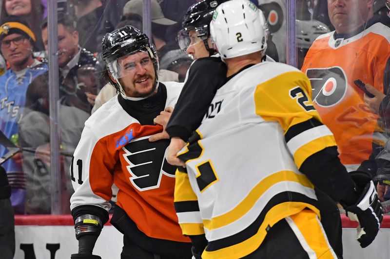 Jan 8, 2024; Philadelphia, Pennsylvania, USA; Philadelphia Flyers right wing Travis Konecny (11) smiles at Pittsburgh Penguins defenseman Chad Ruhwedel (2) during the second period at Wells Fargo Center. Mandatory Credit: Eric Hartline-USA TODAY Sports