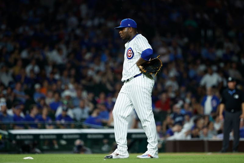 Jun 17, 2024; Chicago, Illinois, USA; Chicago Cubs relief pitcher Héctor Neris (51) reacts after giving up a three-run home run to San Francisco Giants second baseman Thairo Estrada during the ninth inning at Wrigley Field. Mandatory Credit: Kamil Krzaczynski-USA TODAY Sports