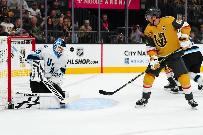 Sep 27, 2024; Las Vegas, Nevada, USA; Utah Hockey Club goaltender Jaxson Stauber (33) makes a save as Vegas Golden Knights right wing Mark Stone (61) looks for a rebound during the second period at T-Mobile Arena. Mandatory Credit: Stephen R. Sylvanie-Imagn Images