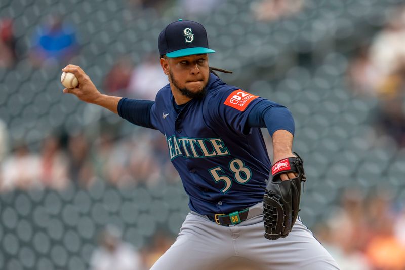 Jun 24, 2025; Minneapolis, Minnesota, USA; Seattle Mariners starting pitcher Luis Castillo (58) delivers a pitch against the Minnesota Twins in the first inning at Target Field. Mandatory Credit: Jesse Johnson-Imagn Images