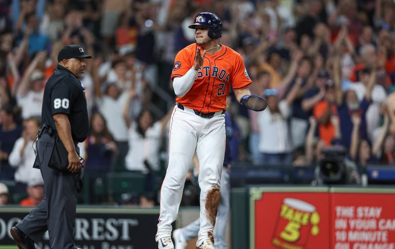 May 3, 2024; Houston, Texas, USA; Houston Astros catcher Yainer Diaz (21) reacts after scoring a run during the seventh inning against the Seattle Mariners at Minute Maid Park. Mandatory Credit: Troy Taormina-USA TODAY Sports
