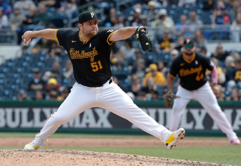 May 12, 2024; Pittsburgh, Pennsylvania, USA;  Pittsburgh Pirates relief pitcher David Bednar (51) pitches against the Chicago Cubs during the ninth inning at PNC Park. Mandatory Credit: Charles LeClaire-USA TODAY Sports