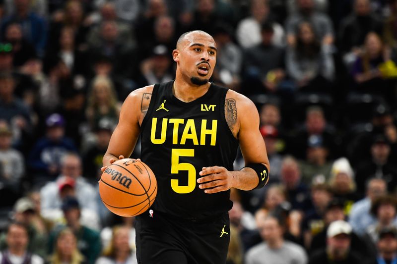 SALT LAKE CITY, UTAH - APRIL 09: Talen Horton-Tucker #5 of the Utah Jazz brings the ball up court in the first half against the Denver Nuggets at Delta Center on April 09, 2024 in Salt Lake City, Utah. NOTE TO USER: User expressly acknowledges and agrees that, by downloading and or using this photograph, User is consenting to the terms and conditions of the Getty Images License Agreement.  (Photo by Alex Goodlett/Getty Images)