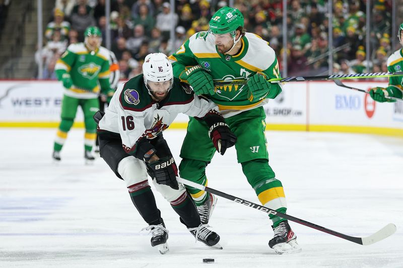 Jan 13, 2024; Saint Paul, Minnesota, USA; Minnesota Wild left wing Marcus Foligno (17) and Arizona Coyotes left wing Jason Zucker (16) compete for the puck during the second period at Xcel Energy Center. Mandatory Credit: Matt Krohn-USA TODAY Sports