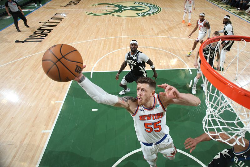 MILWAUKEE, WI - APRIL 7: Isaiah Hartenstein #55 of the New York Knicks grabs the rebound during the game against the Milwaukee Bucks on April 7, 2024 at the Fiserv Forum Center in Milwaukee, Wisconsin. NOTE TO USER: User expressly acknowledges and agrees that, by downloading and or using this Photograph, user is consenting to the terms and conditions of the Getty Images License Agreement. Mandatory Copyright Notice: Copyright 2024 NBAE (Photo by Gary Dineen/NBAE via Getty Images).