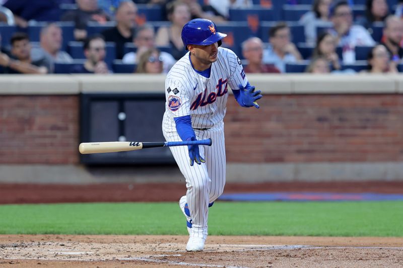 Aug 13, 2024; New York City, New York, USA; New York Mets third baseman Jose Iglesias (11) follows through on an RBI single during the second inning against the Oakland Athletics at Citi Field. Mandatory Credit: Brad Penner-USA TODAY Sports