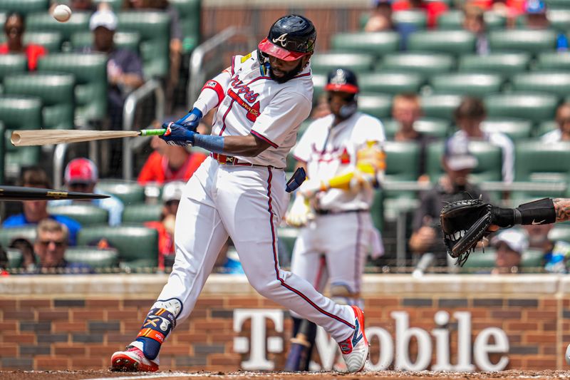 Jun 5, 2025; Cumberland, Georgia, USA; Atlanta Braves center fielder Michael Harris II (23) breaks his bat while hitting a pop up against the Arizona Diamondbacks during the third inning at Truist Park. Mandatory Credit: Dale Zanine-Imagn Images