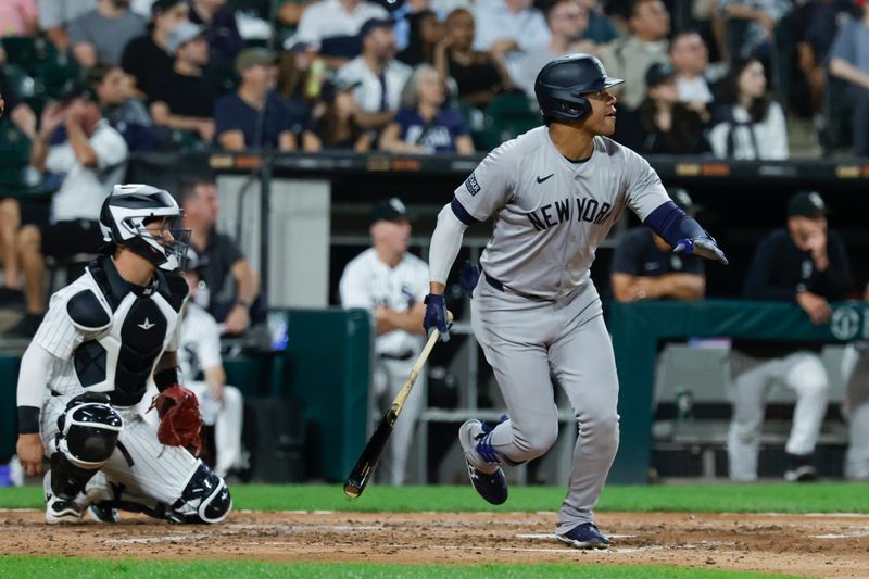 Aug 13, 2024; Chicago, Illinois, USA; New York Yankees outfielder Juan Soto (22) hits a solo home run against the Chicago White Sox during the fifth inning at Guaranteed Rate Field. Mandatory Credit: Kamil Krzaczynski-USA TODAY Sports