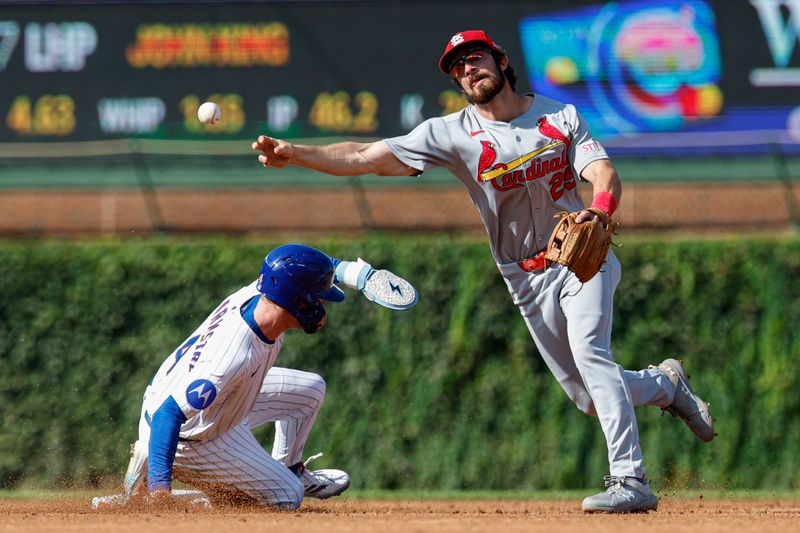 Sep 28, 2025; Chicago, Illinois, USA; St. Louis Cardinals shortstop Thomas Saggese (25) throws out Chicago Cubs center fielder Pete Crow-Armstrong (4) at second base during the third inning at Wrigley Field. Mandatory Credit: Kamil Krzaczynski-Imagn Images