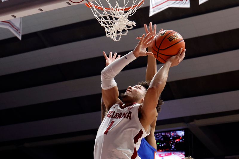 Feb 21, 2024; Tuscaloosa, Alabama, USA; Alabama Crimson Tide guard Mark Sears (1) lays in a basket against the Florida Gators in the first half at Coleman Coliseum. Mandatory Credit: Butch Dill-USA TODAY Sports