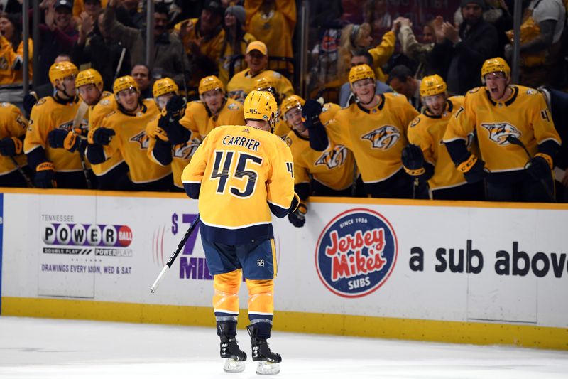 Jan 13, 2024; Nashville, Tennessee, USA; Nashville Predators defenseman Alexandre Carrier (45) celebrates with teammates after scoring the game-winning goal during the third period against the New York Islanders at Bridgestone Arena. Mandatory Credit: Christopher Hanewinckel-USA TODAY Sports