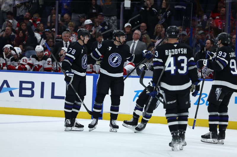 Nov 16, 2024; Tampa, Florida, USA; Tampa Bay Lightning left wing Nick Paul (20) celebrates after scoring a goal against the New Jersey Devils in the first period at Amalie Arena. Mandatory Credit: Nathan Ray Seebeck-Imagn Images