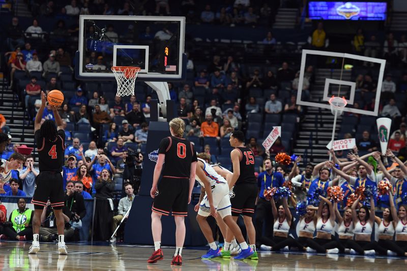 Mar 14, 2024; Nashville, TN, USA; Georgia Bulldogs guard Silas Demary Jr. (4) shoots a free throw as members of the Florida Gators band hold a bake basket in his line of site during the first half at Bridgestone Arena. Mandatory Credit: Christopher Hanewinckel-USA TODAY Sports