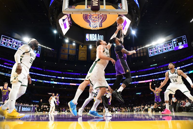 LOS ANGELES, CA - MARCH 8: D'Angelo Russell #1 of the Los Angeles Lakers shoots the ball during the game against the Milwaukee Bucks on March 8, 2024 at Crypto.Com Arena in Los Angeles, California. NOTE TO USER: User expressly acknowledges and agrees that, by downloading and/or using this Photograph, user is consenting to the terms and conditions of the Getty Images License Agreement. Mandatory Copyright Notice: Copyright 2024 NBAE (Photo by Adam Pantozzi/NBAE via Getty Images)