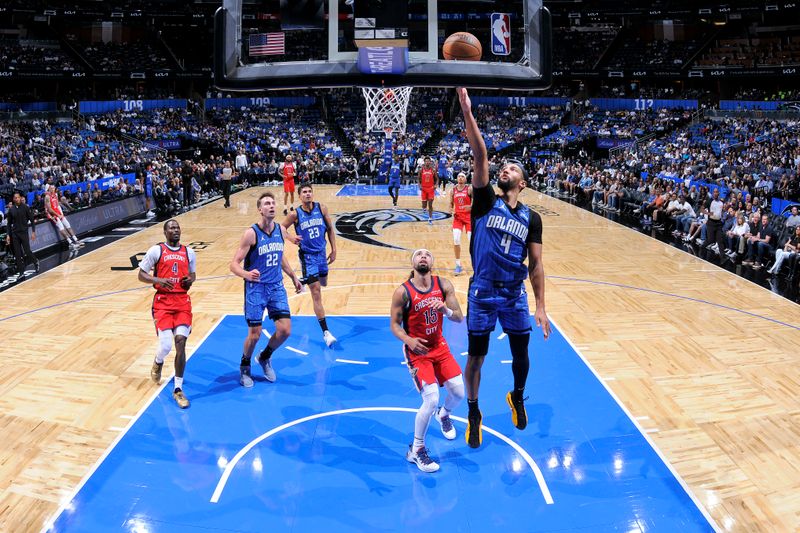 ORLANDO, FL - NOVEMBER 8: Jalen Suggs #4 of the Orlando Magic drives to the basket during the game against the New Orleans Pelicans on November 8, 2024 at the Kia Center in Orlando, Florida. NOTE TO USER: User expressly acknowledges and agrees that, by downloading and or using this photograph, User is consenting to the terms and conditions of the Getty Images License Agreement. Mandatory Copyright Notice: Copyright 2024 NBAE (Photo by Fernando Medina/NBAE via Getty Images)