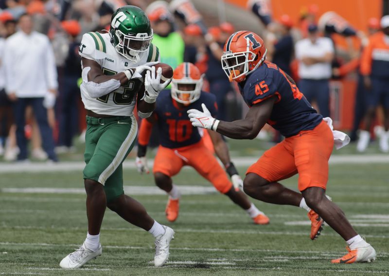 Oct 2, 2021; Champaign, Illinois, USA;  Charlotte 49ers running back Shadrick Byrd (13) makes a reception in front of Illinois Fighting Illini linebacker Khalan Tolson (45) in the second half at Memorial Stadium. Mandatory Credit: Ron Johnson-USA TODAY Sports



