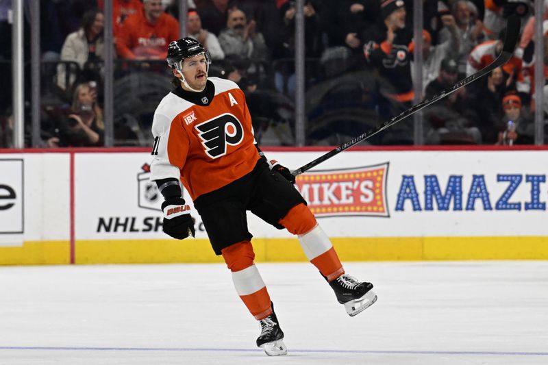 Dec 3, 2025; Philadelphia, Pennsylvania, USA; Philadelphia Flyers right wing Travis Konecny (11) celebrates his goal against the Buffalo Sabres during the first period at Xfinity Mobile Arena. Mandatory Credit: Eric Hartline-Imagn Images