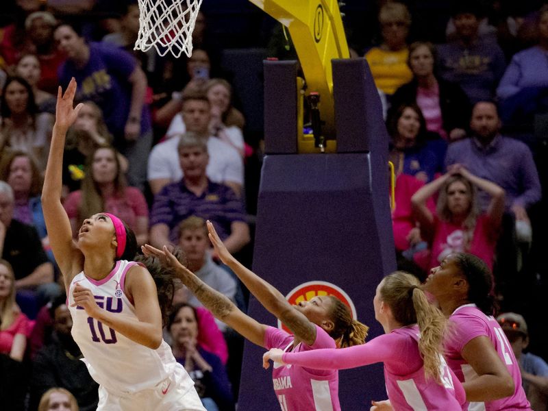 Feb 11, 2024; Baton Rouge, Louisiana, USA; LSU Lady Tigers forward Angel Reese (10) makes a basket against Alabama Crimson Tide guard Del'Janae Williams (51) during the second half at Pete Maravich Assembly Center. Mandatory Credit: Matthew Hinton-USA TODAY Sports