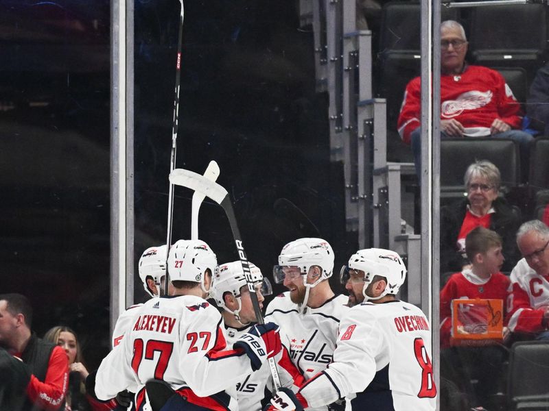 Feb 27, 2024; Detroit, Michigan, USA; Washington Capitals center Hendrix Lapierre (29) celebrates his goal with teammates during the second period against the Detroit Red Wings at Little Caesars Arena. Mandatory Credit: Tim Fuller-USA TODAY Sports