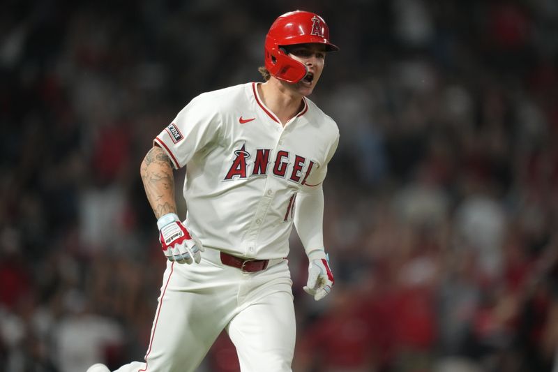 Aug 31, 2024; Anaheim, California, USA; Los Angeles Angels center fielder Mickey Moniak (16) celebrates after hitting a walk-off home run in the ninth inning against the Seattle Mariners at Angel Stadium. Mandatory Credit: Kirby Lee-USA TODAY Sports