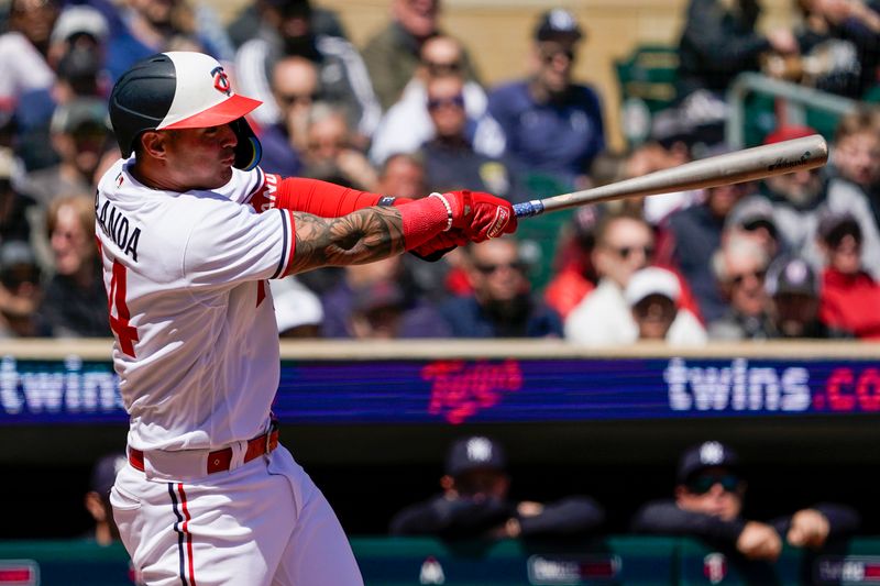 Apr 26, 2023; Minneapolis, Minnesota, USA; Minnesota Twins designated hitter Jose Miranda (64) hits a two-run home run against the New York Yankees during the fourth inning at Target Field. Mandatory Credit: Nick Wosika-USA TODAY Sports

