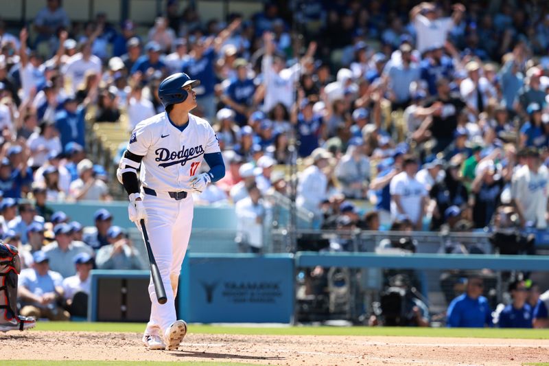 May 5, 2024; Los Angeles, California, USA;  Los Angeles Dodgers designated hitter Shohei Ohtani (17) hits a home run during the eighth inning against the Atlanta Braves at Dodger Stadium. Mandatory Credit: Kiyoshi Mio-USA TODAY Sports